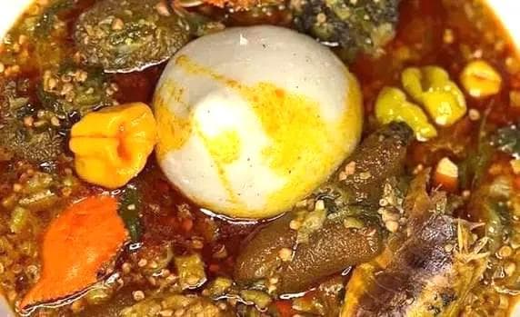 Classic Ghanaian banku served with hearty okra stew in palm oil and tomatoes.