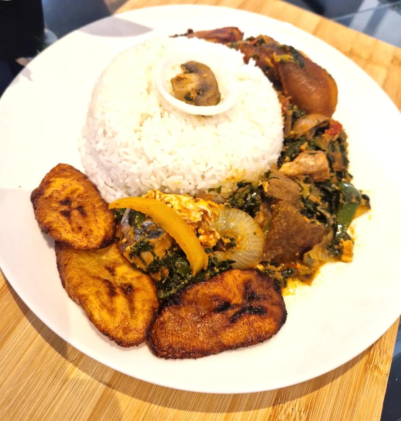 Tasty plain rice with original Ghanaian palava sauce.