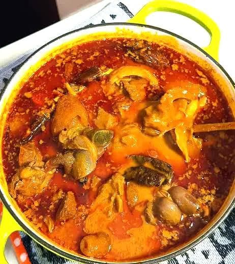 Rich and comforting palm nut soup made from fresh palm fruit.