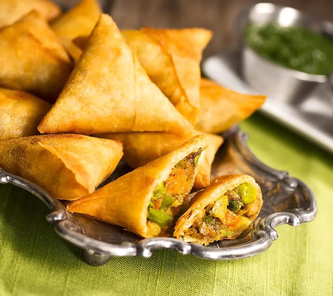 Golden, crunchy samosa with a savory spiced meat filling.