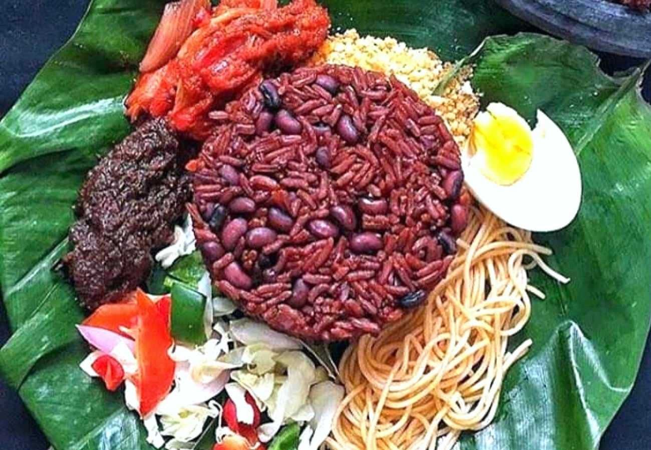 Traditional Ghanaian waakye served with rich veggies, egg, and meat.